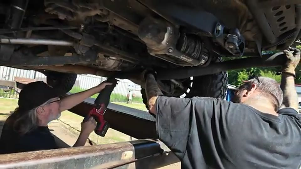 The WK2 underside at Kitsap Muffler while the new rear exhaust route was fitted